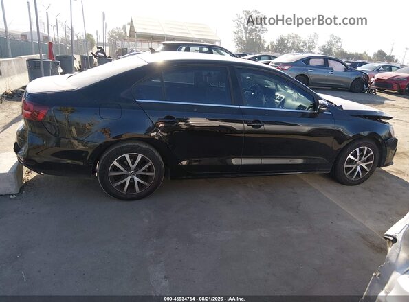 3VWDB7AJ5HM238542 2017 VOLKSWAGEN JETTA Черный Вид задней части салона