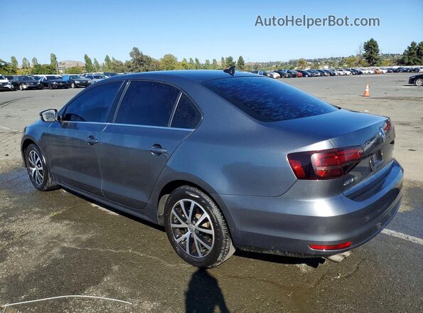 3VWDB7AJ9HM299473 2017 VOLKSWAGEN JETTA Gray Trasero izquierdo