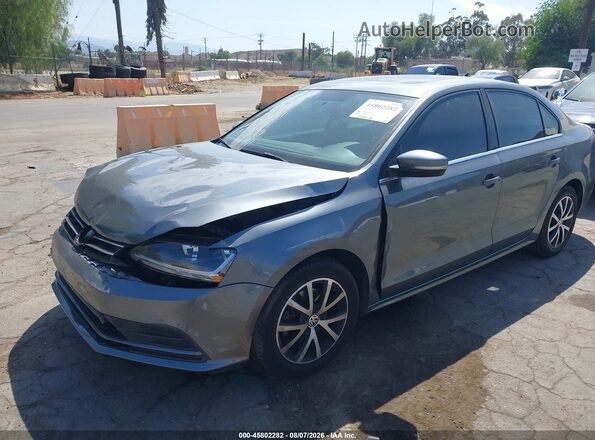 3VWDB7AJXJM263071 2018 VOLKSWAGEN JETTA Gray Front left