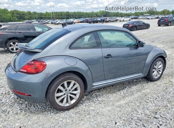 3VWF17ATXHM619462 2017 VOLKSWAGEN BEETLE Gray Trasero derecho