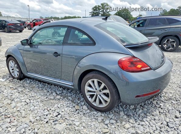 3VWF17ATXHM619462 2017 VOLKSWAGEN BEETLE Gray Trasero izquierdo