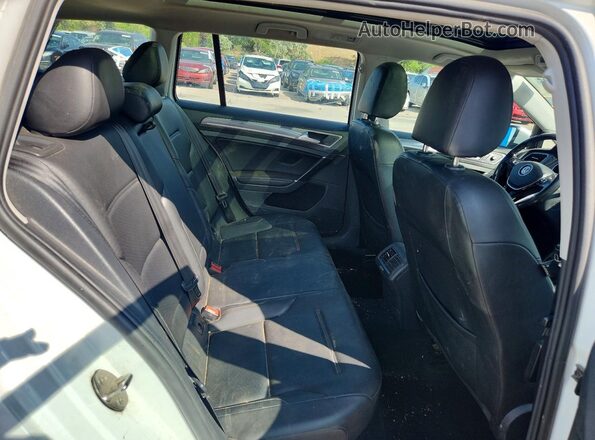 3VWM17AUXHM540857 2017 VOLKSWAGEN GOLF White Rear interior view