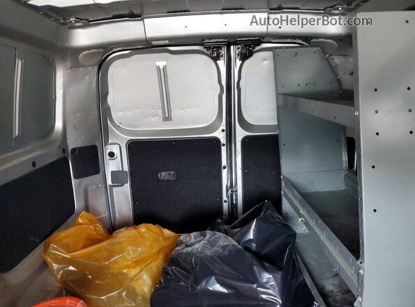 3N6CM0KN1GK699553 2016 NISSAN NV200 White Սալոնի հետևի տեսք