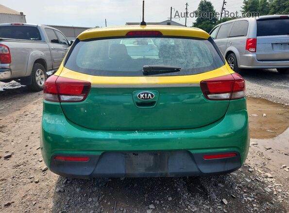 3KPA25AB8JE119984 2018 KIA RIO Yellow Vista interior delantera