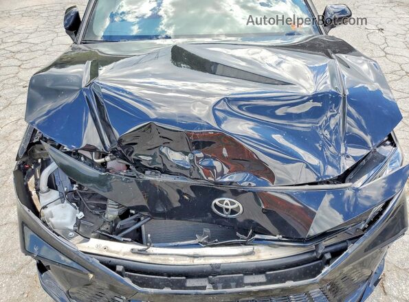 4T1DAACK7SU016950 2025 TOYOTA CAMRY Black Սալոնի հետևի տեսք
