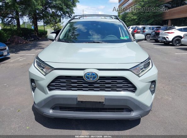 4T3RWRFV0MU026693 2021 TOYOTA RAV4 HYBRID Silver Вид задньої частини салону