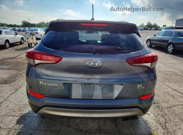 KM8J3CA26GU050249 2016 HYUNDAI TUCSON Gray წინა სალონის ხედი