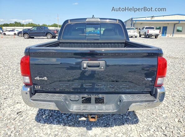 3TMCZ5AN7PM548983 2023 TOYOTA TACOMA Black Front interior view