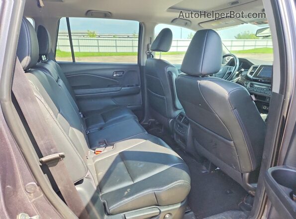 5FNYF6H56GB093283 2016 HONDA PILOT Silver Rear interior view