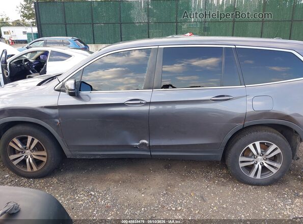 5FNYF6H57JB053110 2018 HONDA PILOT Gray Widok wnętrza z tyłu