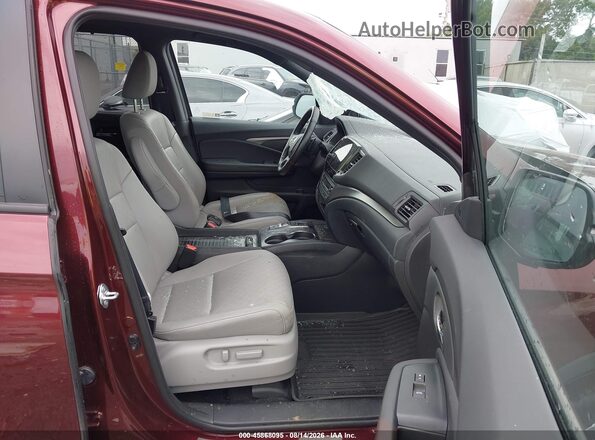 5FNYF8H51MB036786 2021 HONDA PASSPORT Maroon Front interior view