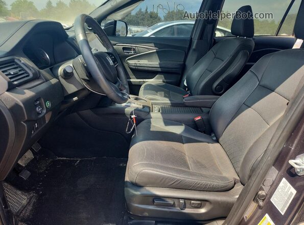 5FNYF8H55MB038394 2021 HONDA PASSPORT Gray Вид салону спереду