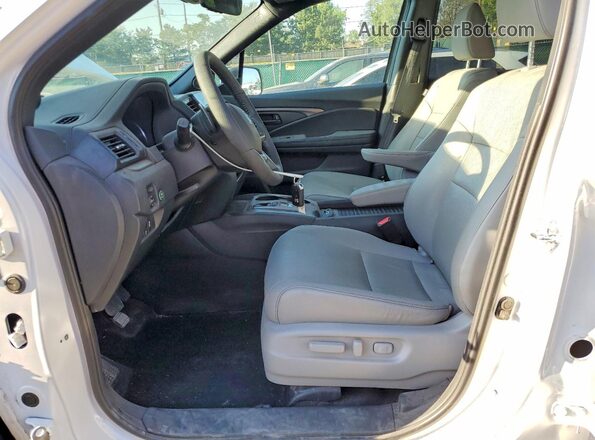 5FNYF8H57PB033606 2023 HONDA PASSPORT White Vista interior delantera