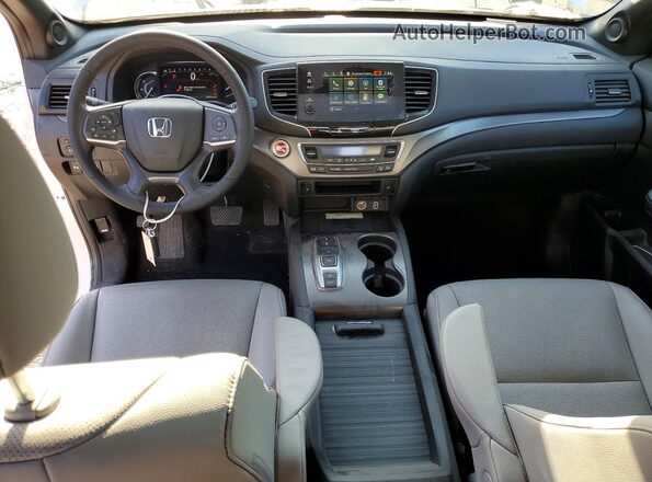 5FNYF8H57PB033606 2023 HONDA PASSPORT White Vista del salpicadero