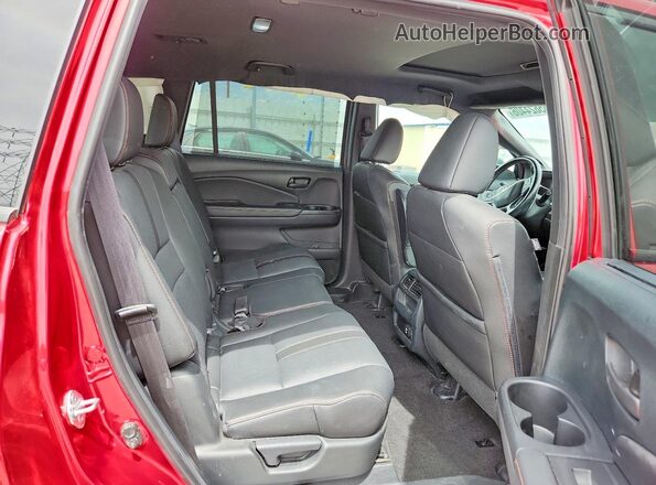 5FNYF8H60PB036436 2023 HONDA PASSPORT Red Вид задньої частини салону