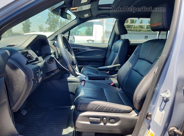 5FNYF8H61PB002957 2023 HONDA PASSPORT Gray Widok wnętrza z przodu