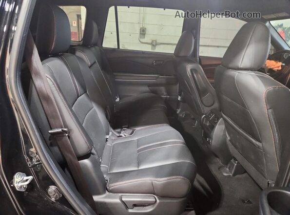 5FNYF8H67PB008827 2023 HONDA PASSPORT Black Rear interior view