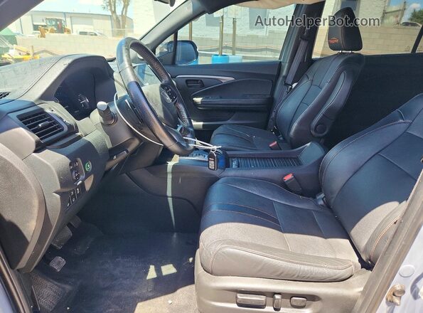 5FNYF8H69PB034278 2023 HONDA PASSPORT Gray Widok wnętrza z przodu