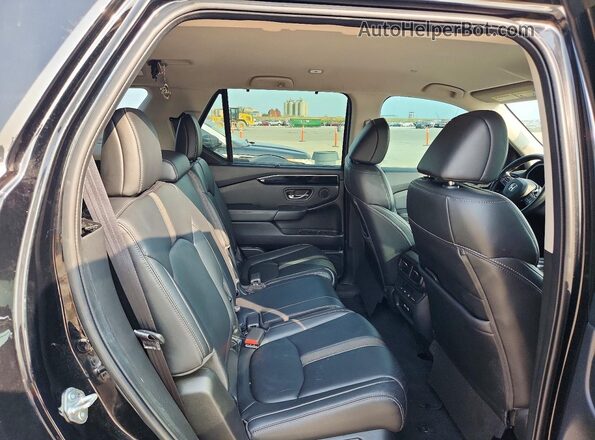 5FNYG2H41PB002126 2023 HONDA PILOT Черный Вид задней части салона