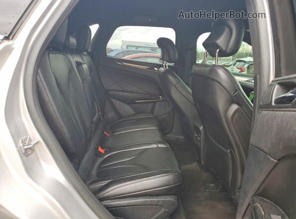 5LMCJ1C97GUJ00859 2016 LINCOLN MKC Серебряный Вид задней части салона