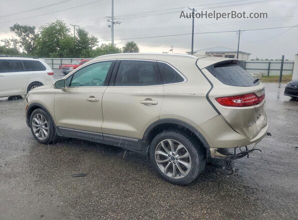 5LMCJ2C98HUL13715 2017 LINCOLN MKC Beige Trasero izquierdo