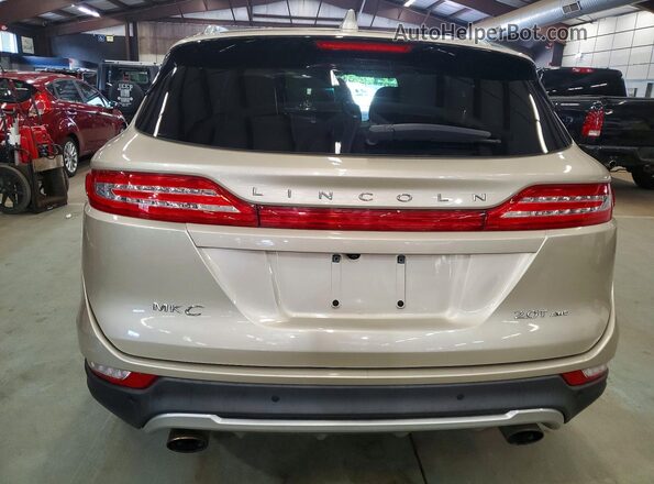 5LMCJ2D95HUL62174 2017 LINCOLN MKC Tan Widok z tyłu