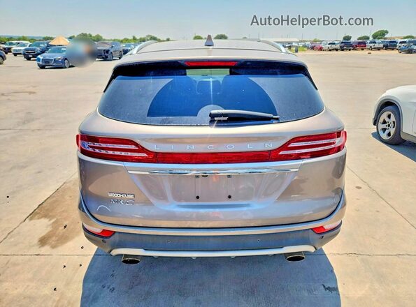 5LMCJ2D97KUL53211 2019 LINCOLN MKC Tan Vista trasera