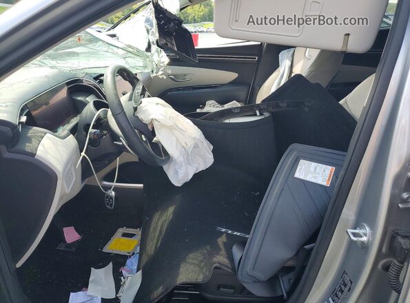 5NMJE3AE7PH222496 2023 HYUNDAI TUCSON Серебряный Вид салона спереди