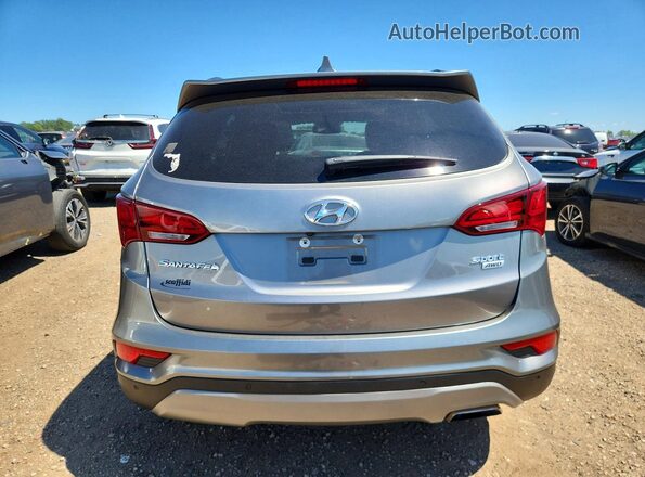 5NMZUDLB1HH035819 2017 HYUNDAI SANTA Beige Widok z tyłu