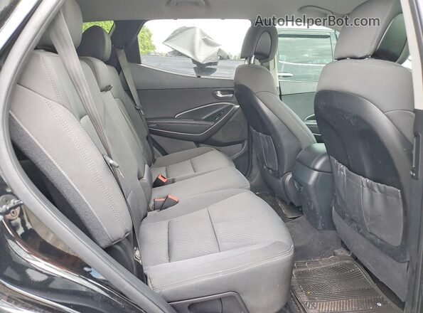 5NMZUDLB9HH038130 2017 HYUNDAI SANTA Black Rear interior view