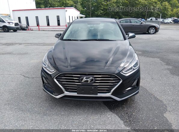 5NPE24AA0KH757002 2019 HYUNDAI SONATA Черный Вид задней части салона