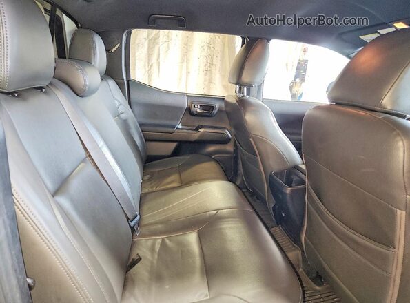 5TFDZ5BNXHX025844 2017 TOYOTA TACOMA White Vista de los asientos traseros
