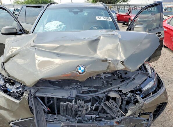 5UX13EU08S9Y64505 2025 BMW X5 Green Rear interior view