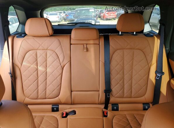 5UX23EU07R9W14123 2024 BMW X5 Blue Rear seats view