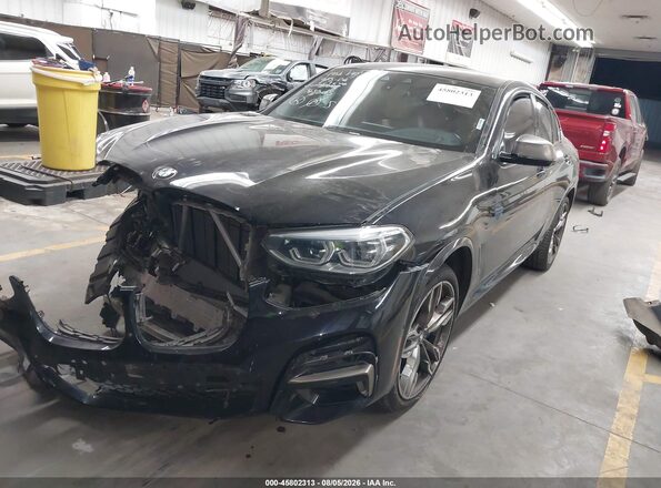 5UX2V5C02LLE69646 2020 BMW X4 Black Առջևի ձախ երեք քառորդ տեսարան