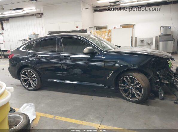 5UX2V5C02LLE69646 2020 BMW X4 Black Սալոնի հետևի տեսք
