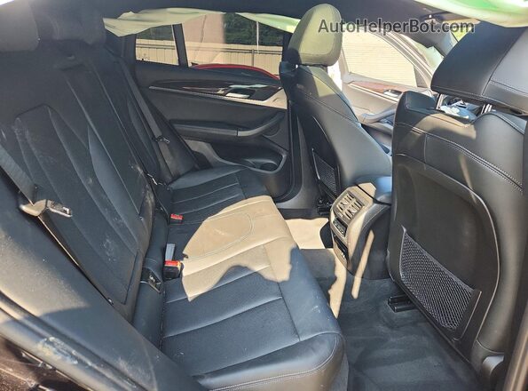 5UX33DT08R9X09659 2024 BMW X4 Black Rear interior view