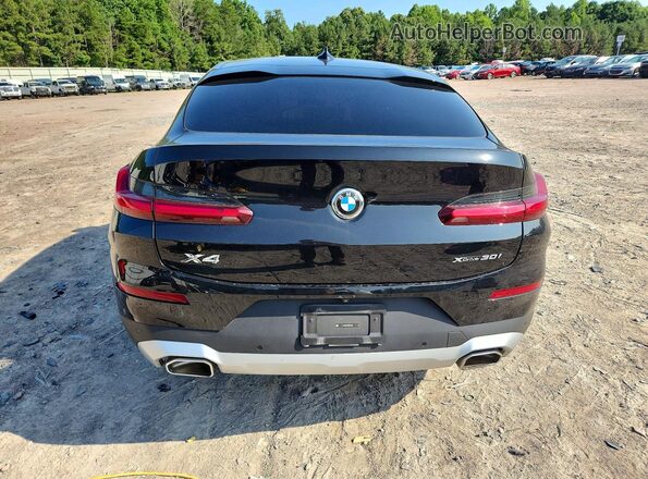 5UX33DT08R9X09659 2024 BMW X4 Black Rear view