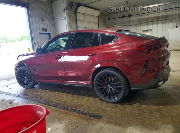 5UX33EX04T9322792 2026 BMW X6 Burgundy Trasero izquierdo