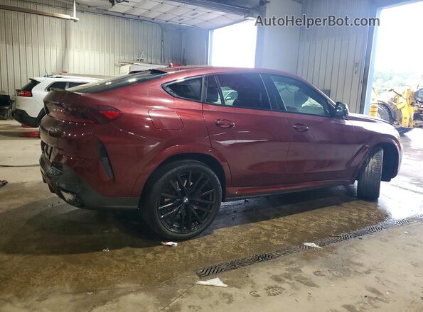 5UX33EX04T9322792 2026 BMW X6 Burgundy Trasero derecho