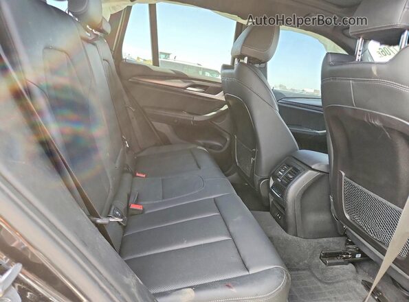 5UX53DP07P9S65982 2023 BMW X3 Charcoal Вид задньої частини салону