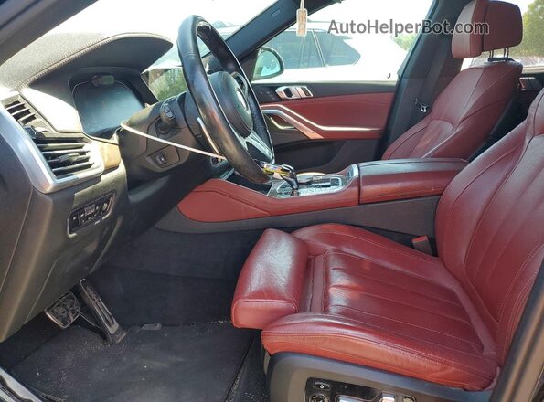 5UXCY6C01L9D04637 2020 BMW X6 Black Vista interior delantera