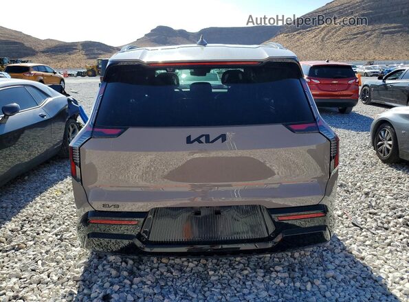 5XYADFS5XTG009372 2026 KIA EV9 Tan Rear view