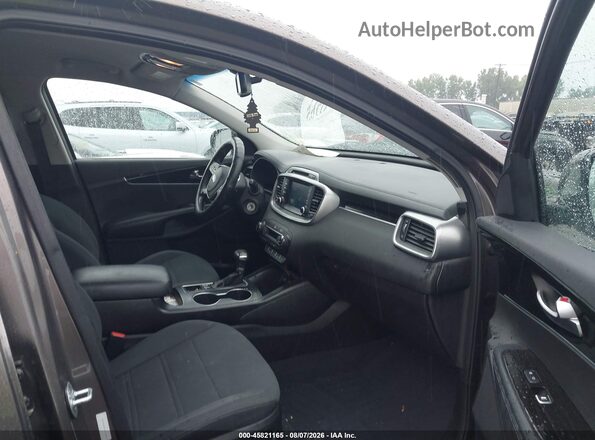 5XYPGDA30KG439500 2019 KIA SORENTO Коричневый Вид салона спереди