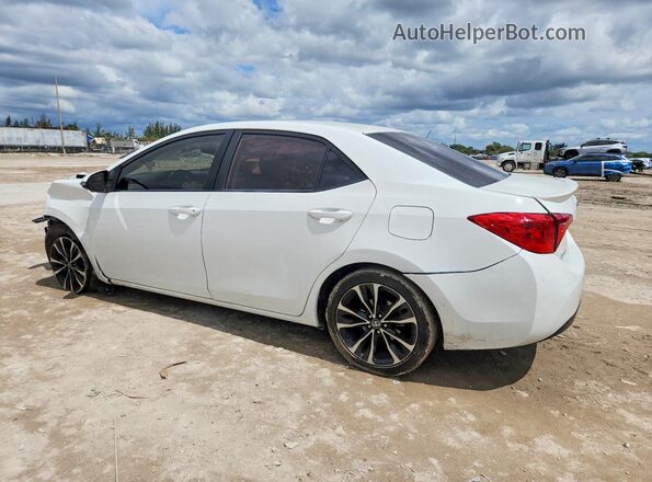 5YFBURHE1KP856286 2019 TOYOTA COROLLA White Trasero izquierdo