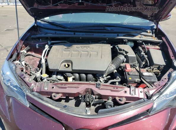 5YFBURHE4HP573101 2017 TOYOTA COROLLA Burgundy Vista interior trasera