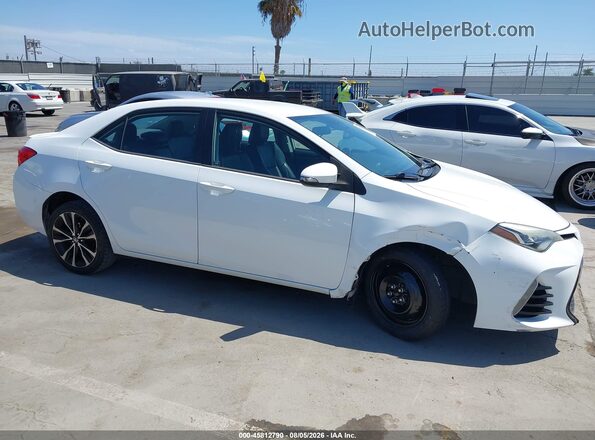 5YFBURHE4HP674655 2017 TOYOTA COROLLA White Widok wnętrza z tyłu