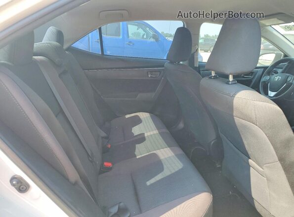 5YFBURHE4HP710487 2017 TOYOTA COROLLA White Rear seats view