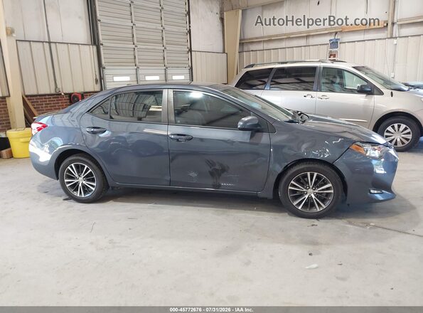 5YFBURHE4JP751465 2018 TOYOTA COROLLA Gray Rear interior view