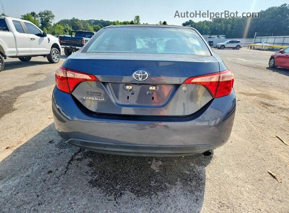 5YFBURHE6HP708675 2017 TOYOTA COROLLA Silver Вид ззаду